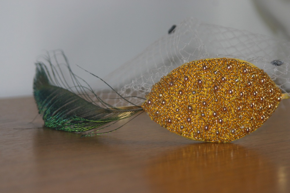 Gold Headband with Peacock Feather and Birdcage Veil